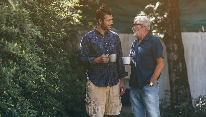 father talking to adult son